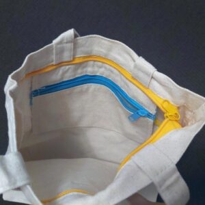 Geniuso TADA funktsionaalne lukkude ja taskutega kandekott